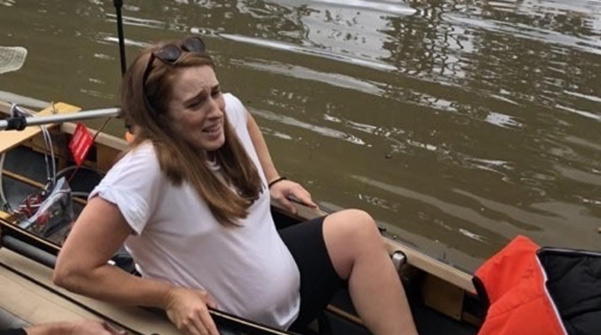 A pregnant lady in a boat